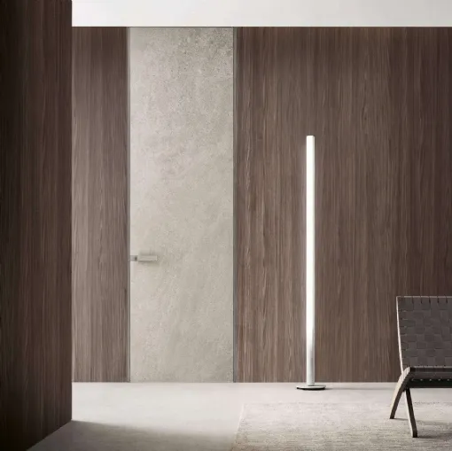 Porta a filo muro per interni Moon in finitura gres crema con struttura in alluminio finitura Platino di Rimadesio